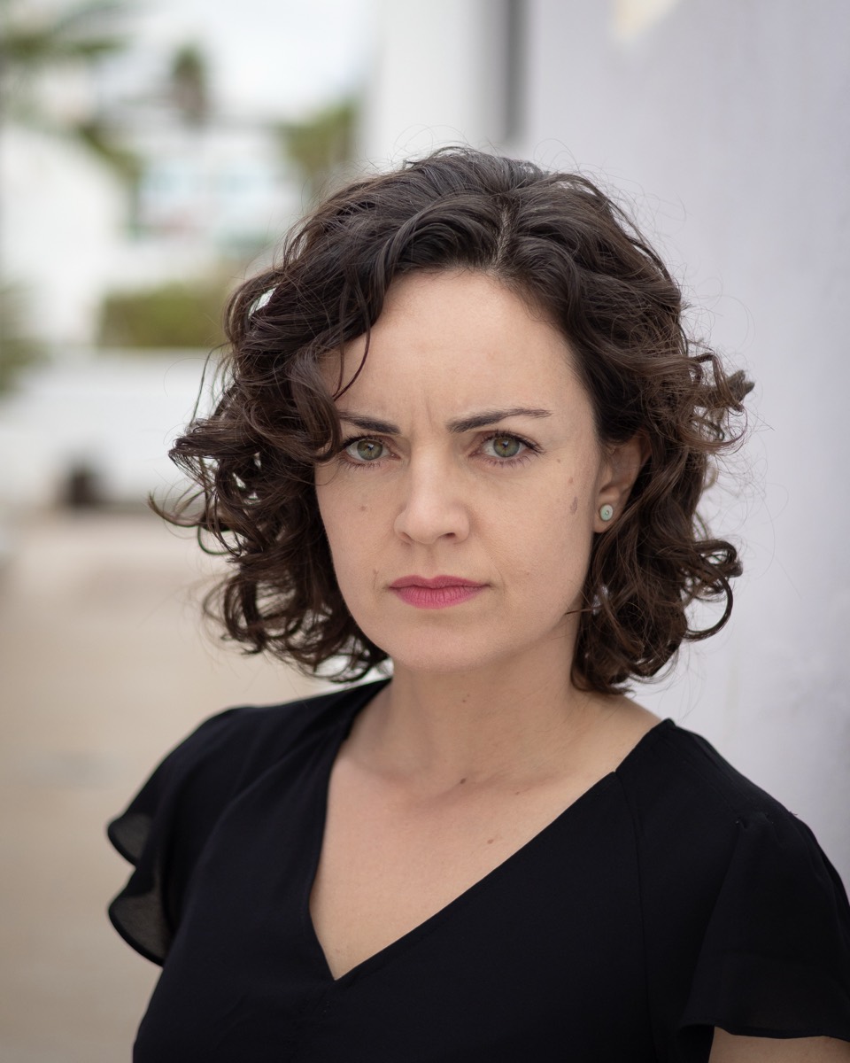 Headshot of Ainhoa Barrio in a plain black top